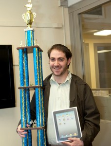 Alon Meltzer, Now You Know contest winner, presented with an iPad and trophy.