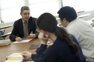 Prof. Itay Zutra, left, helps design lesson plans for the Yiddish Club.