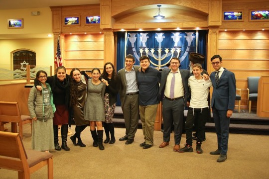 Paramus - Teens From right to left, Hisoriri volunteers Eliyahu Ebrani, Moshe Kurtz, Yoni Kornblau, Irene Razi, Racheli Shafier and Ruthie Klein take a post-shabbos photo with a few of the teenagers that attended their afternoon Hisoriri learning program for Congregation Beth Tefillah of Paramus, New Jersey.