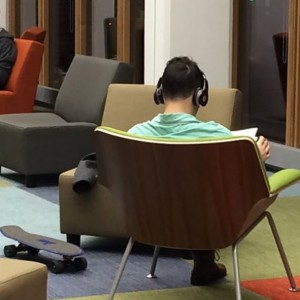 Skateboarding student settles in for an evening of exam preparation in newly renovated Pollack-Gottesman Library
