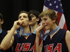 Feld, left, celebrates with his teammates at medal ceremony