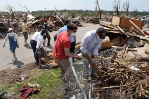 Students on the Kansas City Summer Experience help with disaster clean-up efforts in Joplin, MO.