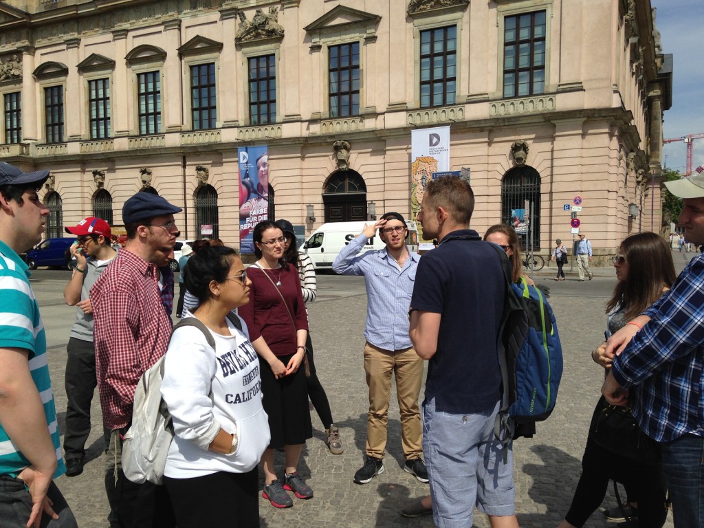 The group enjoys a walking tour of Berlin