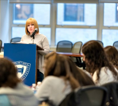 Nechama Price, director of GPATS, speaks at a Yom Iyun on the Beren Campus
