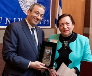 Edith Lubetski Receives Award from Dr. Ari Berman